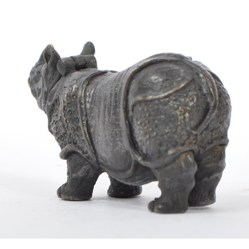 358 - A bronzed metal vesta case in the form of a rhinoceros with hinge to head and match strike to underb... 