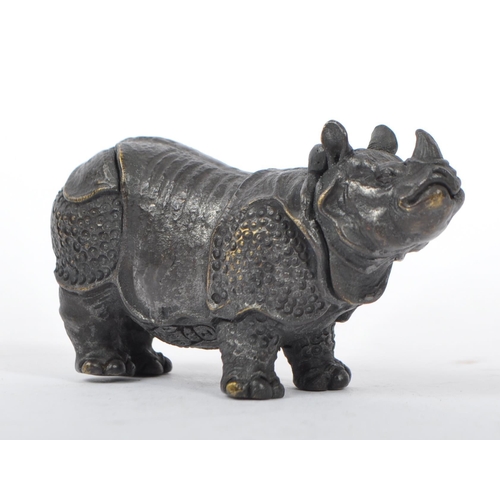 358 - A bronzed metal vesta case in the form of a rhinoceros with hinge to head and match strike to underb... 