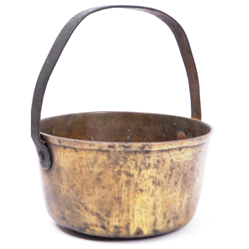 362 - A 19th century Victorian brass and cast iron jam pan having hoop carry handle to top, together wit h... 