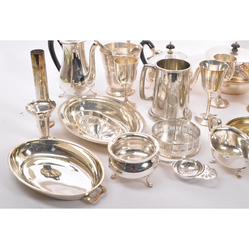 369 - A large collection of polished silver plated wares. To include, goblets, dishes, condiments, gravy b... 