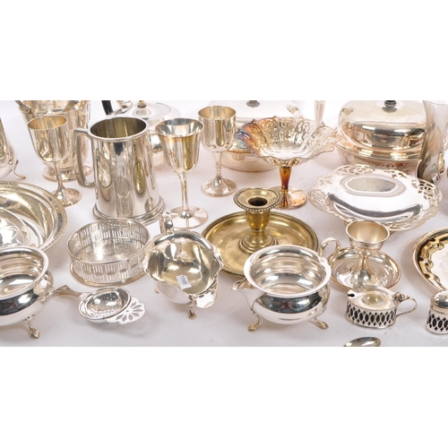 369 - A large collection of polished silver plated wares. To include, goblets, dishes, condiments, gravy b... 