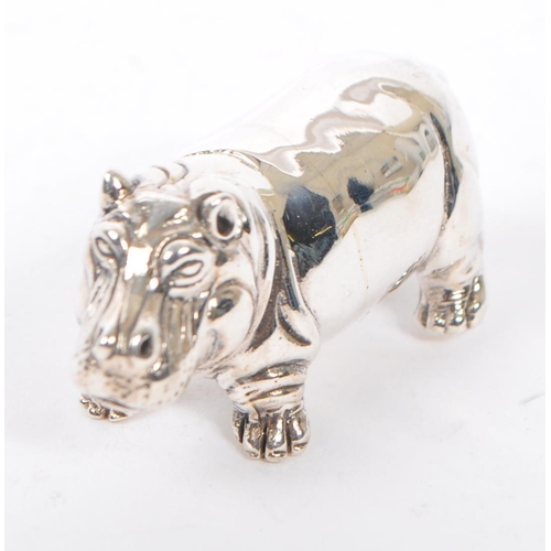 370 - A silver stamped 925 hippopotamus figure modelled standing and being stamped 925 sterling. Measures ... 