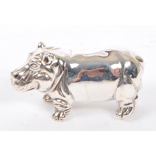 370 - A silver stamped 925 hippopotamus figure modelled standing and being stamped 925 sterling. Measures ... 