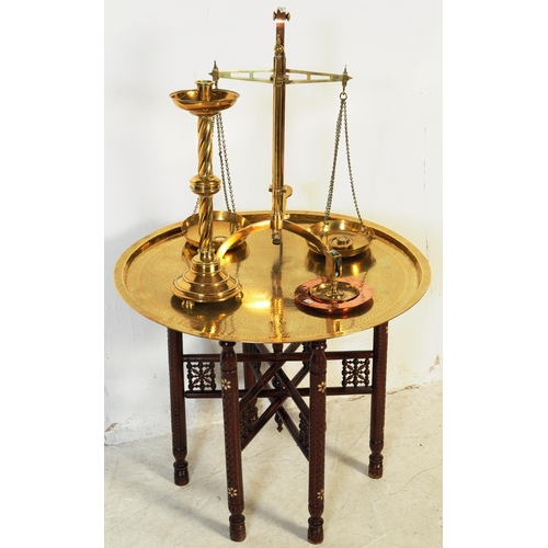 373 - A collection of brass to include scales, charger with Binares folding base, spiral candlestick and o... 