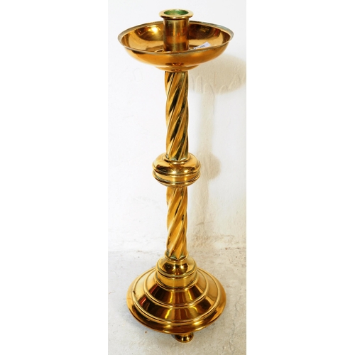 373 - A collection of brass to include scales, charger with Binares folding base, spiral candlestick and o... 