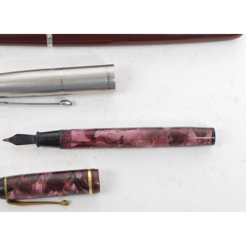 377 - Conway Stewart Dinkie - A vintage 20th century 14 carat nib fountain pen together with a Parker 61 p... 