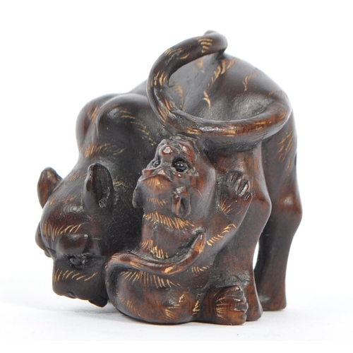 378 - A 20th century Japanese signed carved wood netsuke in the form of a tigress with tiger cub with glas... 