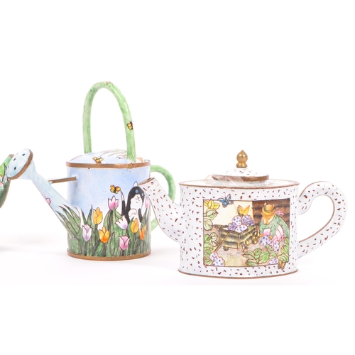 381 - Four late 20th century miniature enamel & brass tea pots / watering can by Empress Arts. Lot to incl... 