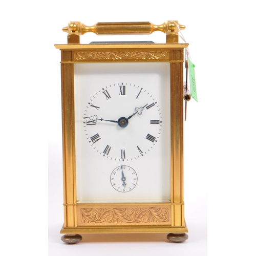 382 - A large 19th century French brass carriage clock. The clock having handle to top with case having ha... 