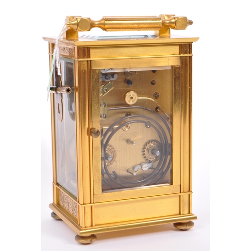 382 - A large 19th century French brass carriage clock. The clock having handle to top with case having ha... 