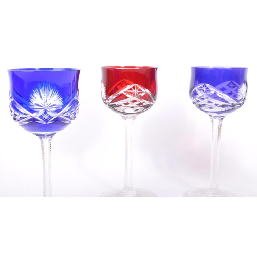 4 - A set of four early 20th century Bohemian studio coloured cut glass wine glasses. Set includes four ... 