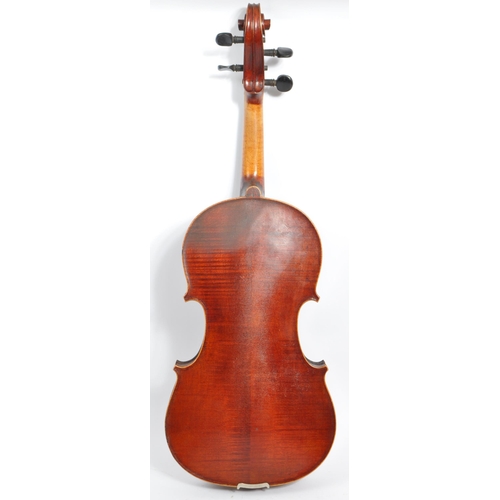 404 - An early 20th century circa 1900 French full 4/4 two piece violin with pair of bows. The violin havi... 