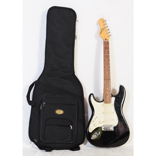 409 - A vintage electric guitar by Encore. Stratocaster style guitar / musical instrument having a black b... 