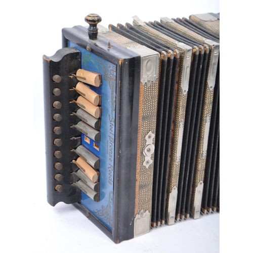 415 - A vintage 20th century Germany piano accordion squeeze box musical instrument. With steel bronze ree... 