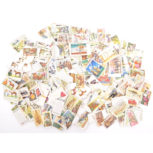 450 - A large collection of vintage 20th century cigarette cards. All collection and displayed over albums... 