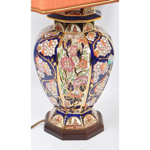 52 - A large 20th century ceramic ginger jar style lamp. Having a cobalt blue colouring with gilt detaili... 