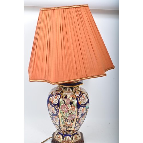 52 - A large 20th century ceramic ginger jar style lamp. Having a cobalt blue colouring with gilt detaili... 