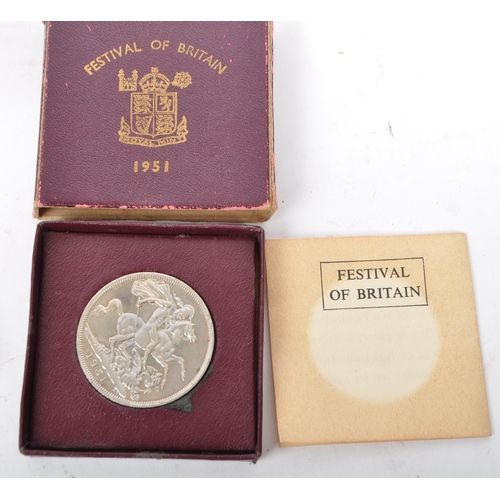 522 - A collection of four mid 20th century and later UK & foreign coins. Comprising of a 1966 Canadian do... 