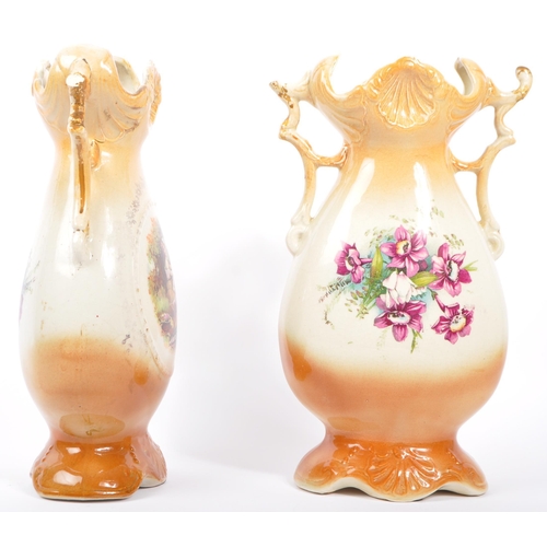 68 - A pair of 1909-1917 Wild & Adams, Longton, Stoke-on-Trent pottery mantle vases, decorated with flowe... 