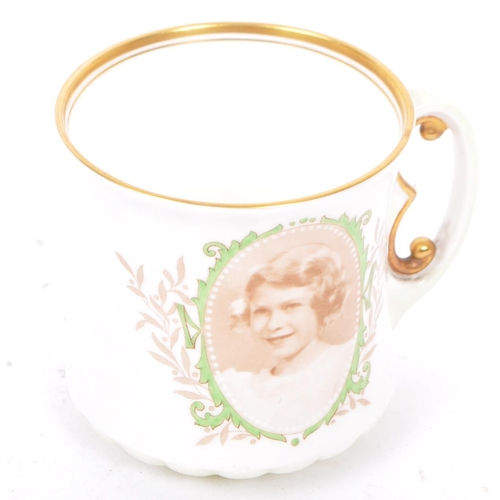 69 - Of Royal Interest - A 1937 Princess Elizabeth Royal Doulton porcelain mug with E handle. Printed wit... 