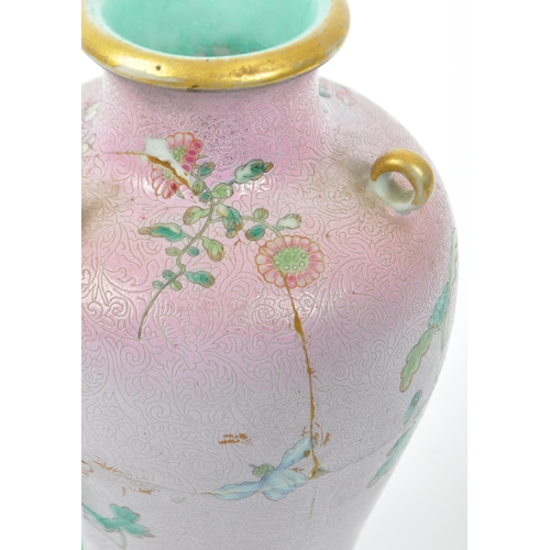 80 - An 18th century Qing Dynasty Chinese famille rose vase. The vase having pink foliate ground with han... 