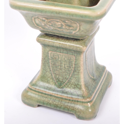 85 - A large 19th century Chinese Wacai Gu form archaic style ceramic green glazed candlestick. The candl... 