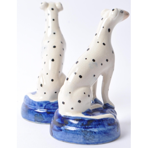 9 - A pair of early 20th century Staffordshire style ceramic pottery Dalmatian dogs. In a seated positio... 