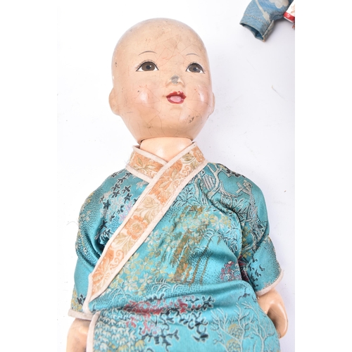 289 - A collection of ten early 20th century circa 1930s Chinese Oriental hand painted child's dolls. The ... 