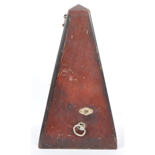 292 - A vintage 20th century wooden construction musical tempo metronome. In a painted pyramid wooden hous... 