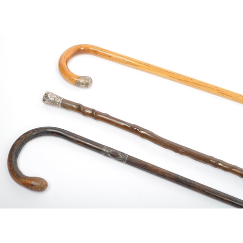 327 - Three Edwardian circa 1900 and later silver topped and collared walking sticks / canes. One being ha... 