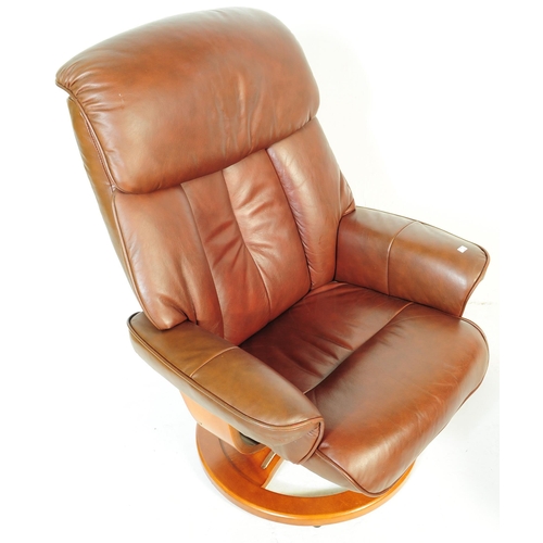 599 - A retro mid 20th century Ekornes stressless style reclining swivel armchair. Having a rectangular cu... 
