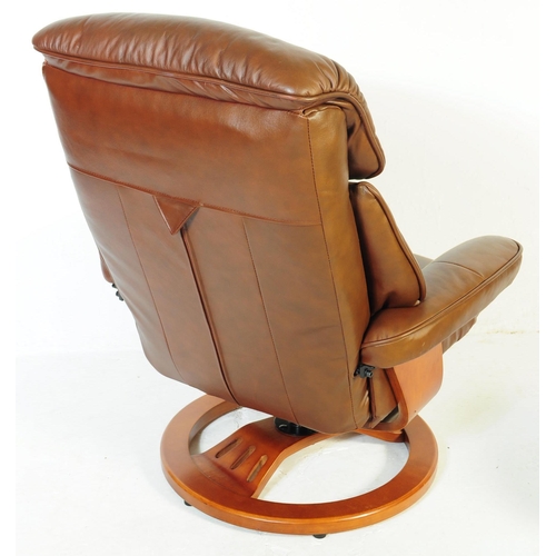 599 - A retro mid 20th century Ekornes stressless style reclining swivel armchair. Having a rectangular cu... 