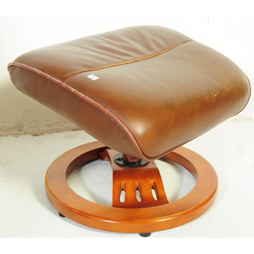 599 - A retro mid 20th century Ekornes stressless style reclining swivel armchair. Having a rectangular cu... 