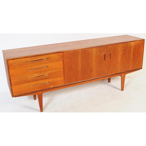 601 - Meredew Furniture - A vintage 20th century teak wood sideboard credenza. Of rectangular shape with a... 