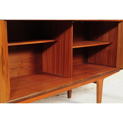 601 - Meredew Furniture - A vintage 20th century teak wood sideboard credenza. Of rectangular shape with a... 