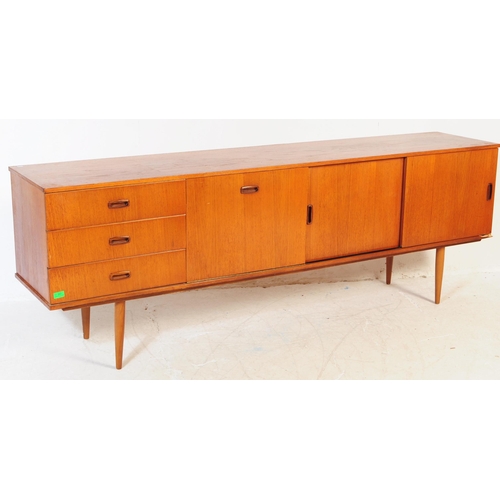 602 - British Modern Design - Vintage 20th century teak sideboard credenza. Of rectangular form with a ban... 