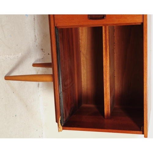 602 - British Modern Design - Vintage 20th century teak sideboard credenza. Of rectangular form with a ban... 