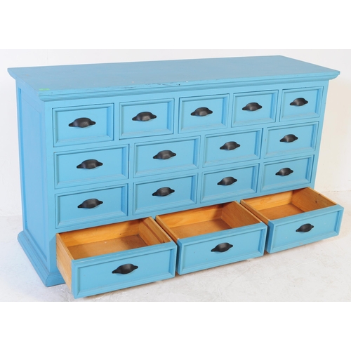 605 - A contemporary large painted merchants double chest of drawers. The large painted painted pine body ... 