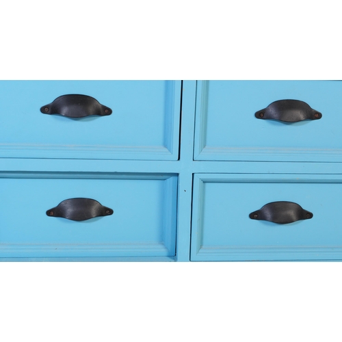 605 - A contemporary large painted merchants double chest of drawers. The large painted painted pine body ... 