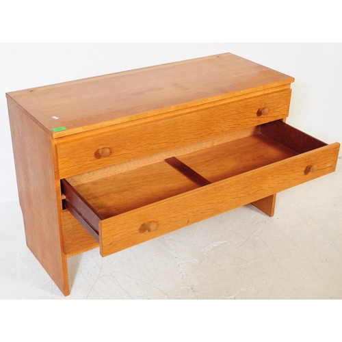 609 - Meredew - A mid 20th century circa 1960s light oak chest of drawers. The chest of drawers having a b... 