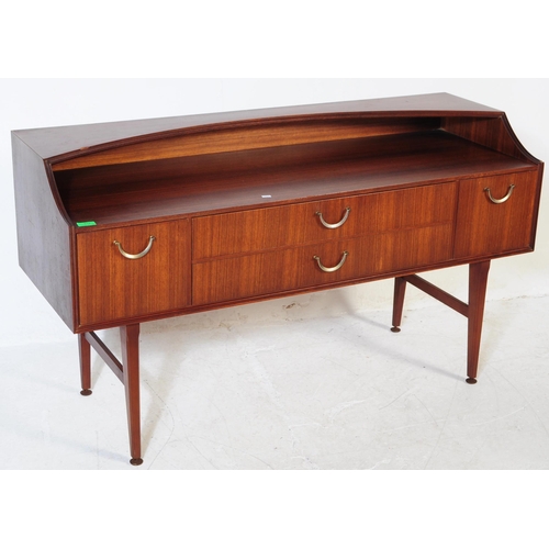 612 - Meredew - A retro mid 20th century circa 1970s afromosia teak sideboard. The credenza having shelved... 