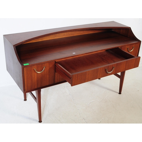 612 - Meredew - A retro mid 20th century circa 1970s afromosia teak sideboard. The credenza having shelved... 