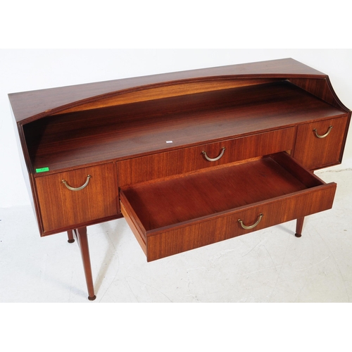 612 - Meredew - A retro mid 20th century circa 1970s afromosia teak sideboard. The credenza having shelved... 
