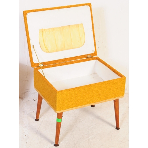 617 - Two mid 20th century retro teak sewing tables. To include example upholstered in a mustard moquette ... 