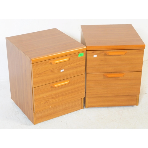621 - British Modern Design - A pair of retro mid 20th century teak bedside cabinets. Each having a bank o... 