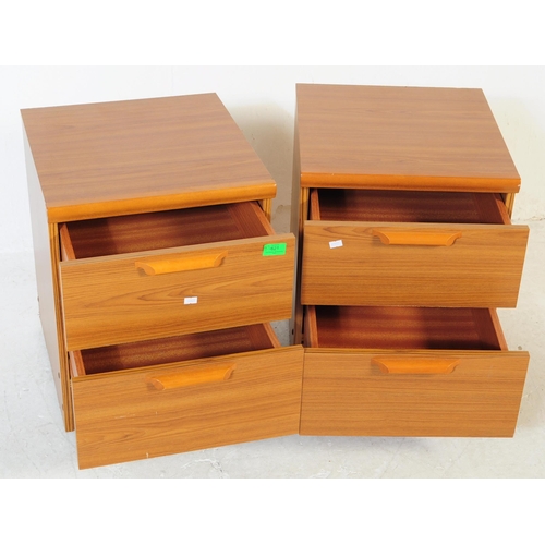 621 - British Modern Design - A pair of retro mid 20th century teak bedside cabinets. Each having a bank o... 