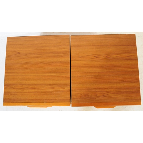 621 - British Modern Design - A pair of retro mid 20th century teak bedside cabinets. Each having a bank o... 