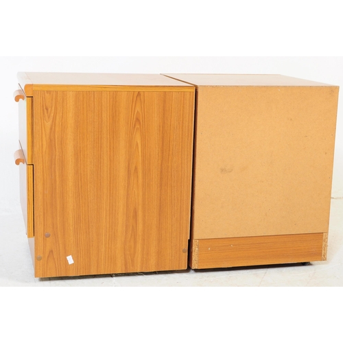 621 - British Modern Design - A pair of retro mid 20th century teak bedside cabinets. Each having a bank o... 