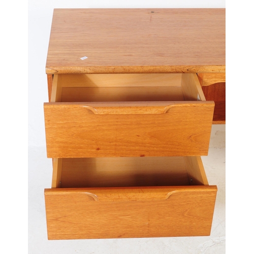 623 - Stonehill - A retro mid 20th century light oak kneehole desk. The desk having central kneehole flank... 