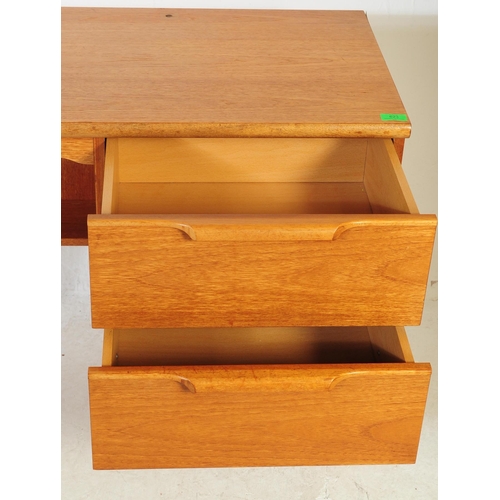 623 - Stonehill - A retro mid 20th century light oak kneehole desk. The desk having central kneehole flank... 